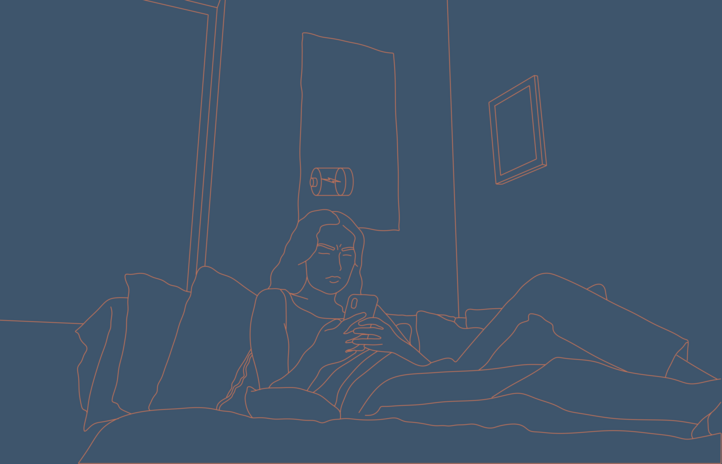woman on bed looking at her phone