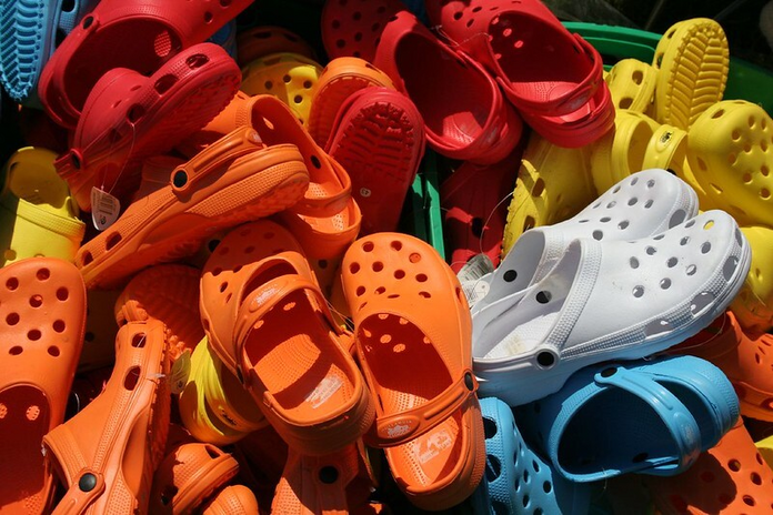 colourful crocs shoes in a pile