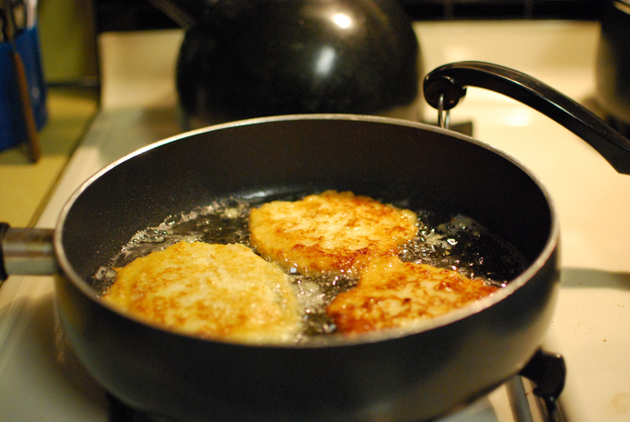 latkes frying in pan