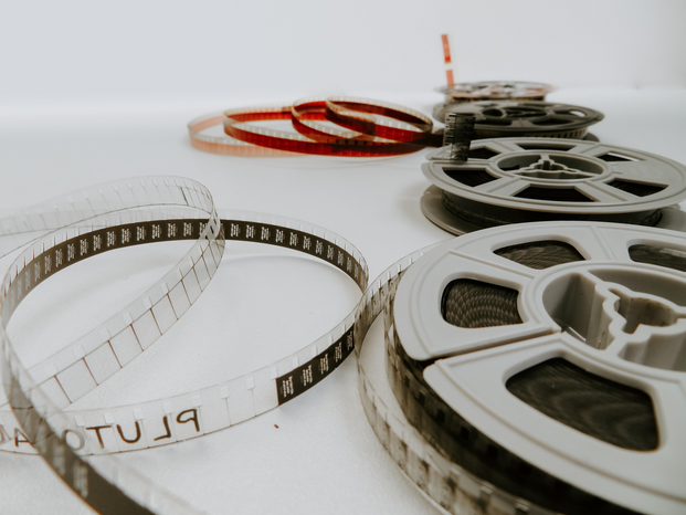 Four film reels on a white background by Denise Jans