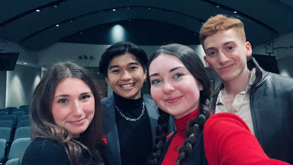 Four club members posing for a selfie