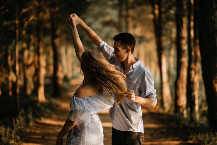 man and woman dancing by Scott Broome on Unsplash