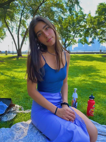 girl in blue dress in park