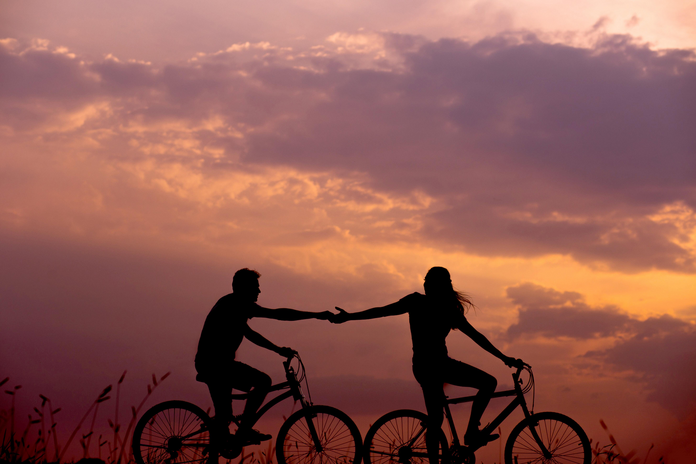 Two bikers at sunset