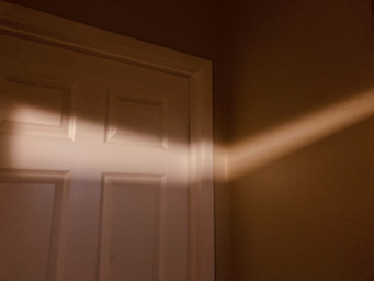 Photo of corner of hall with sunlight peeking through