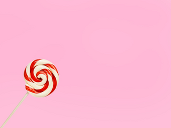 red and white striped lollipop on pink background