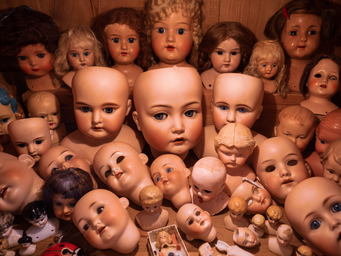 assorted collection of doll heads