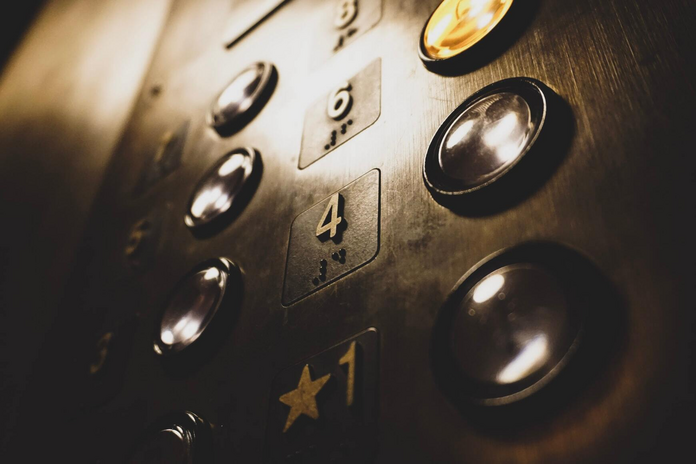 close up of elevator floor buttons