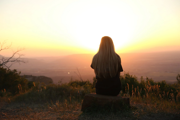 girl sitting in sunset