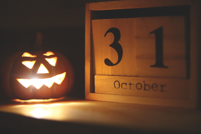 Jack o lantern and date on table