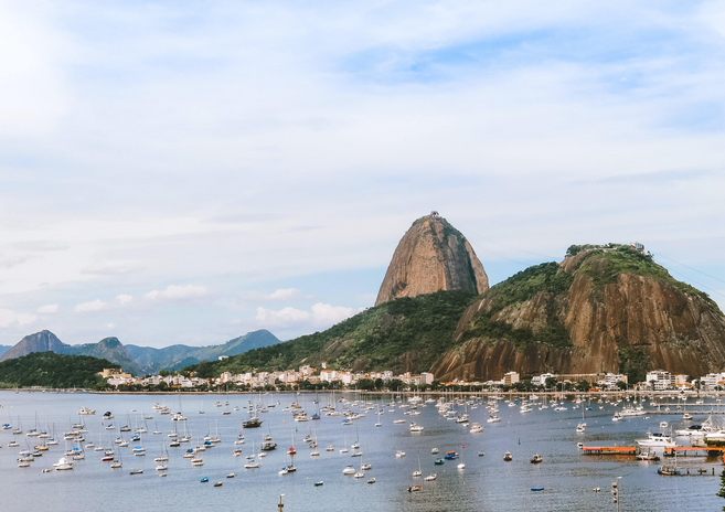 Pão de Açucar hill in Rio de Janeiro and body of water.