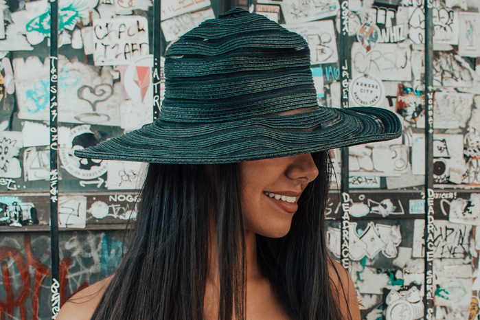 Woman wearing black hat by Unsplash
