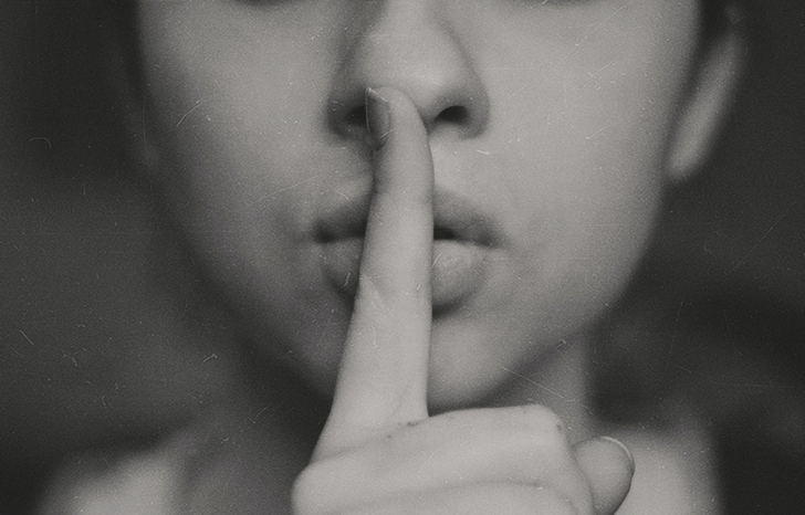 person whispering by Kristina Flour on Unsplash