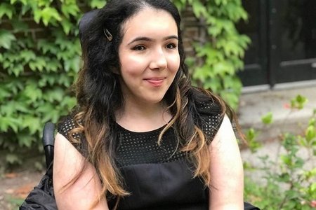 Woman in wheelchair in black dress