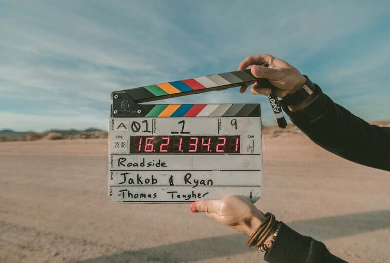 person holding clapperboard