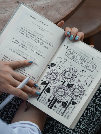 journal with drawings about self love by Prophsee Journals from Unsplash