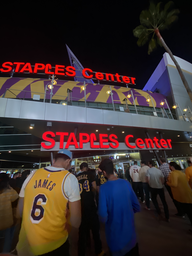 It is the outside of the Staples Center showing people entering the venue