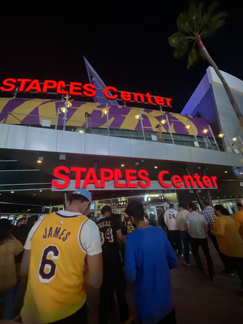 It is the outside of the Staples Center showing people entering the venue