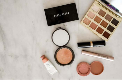 Makeup products on a white surface