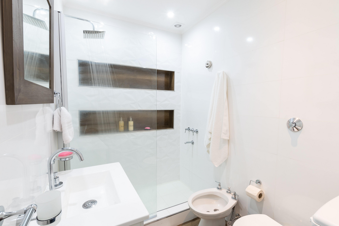 white bathroom with shower by Fred Kleber on Unsplash