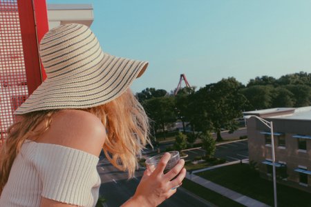 Anna Schultz-Girl In Sunhat Looking Off Balcony