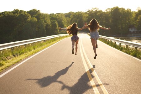 Kayla Bacon-Dramatically Skipping Down Road