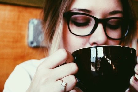 Amelia Kramer-Girl With Glasses Close Up Sipping Latte Coffee Shop