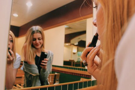 Anna Schultz-Friends Putting Make Up In Front Of Mirror