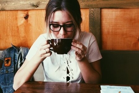 Amelia Kramer-Girl Wearing Glasses Sipping Coffee