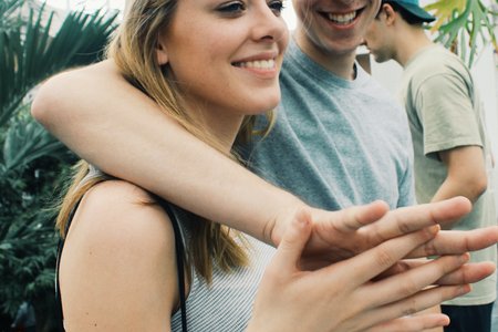 Anna Schultz-Guy With Arm Around Smiling Girl