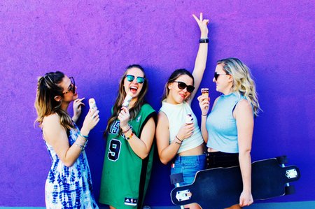 Amelia Kramer-Laughing Group Of Girls In Front Of Purple Mural