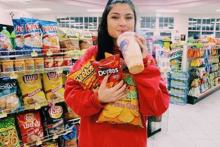 Anna Schultz-Girl With Arms Full At Gas Station
