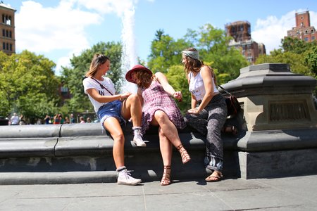 The Lalathree Girls Sitting By A Fountain