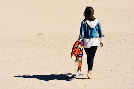 Girl At The Beach Walking With Blanket