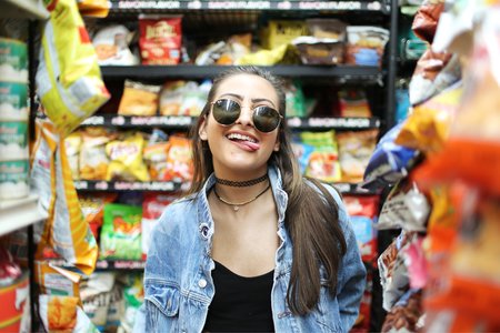 The Lalagirl In Jean Jacket Sticking Her Tongue Out