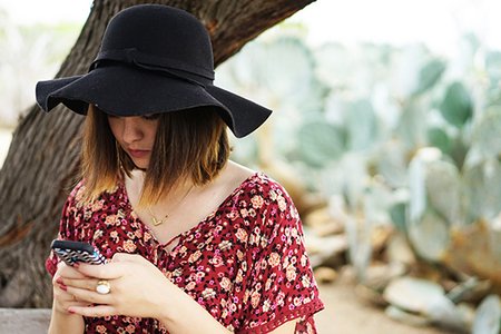 Kellyn Simpkin-Texting Hat Girl Cactus Bench Floral Shirt