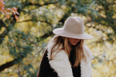 Girl Looking Down In Fuzzy Coat