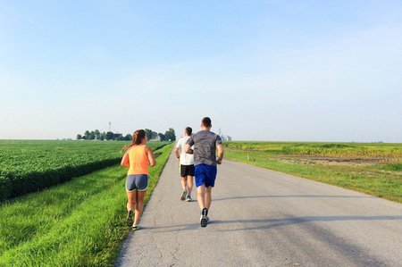 Three People Running In The Countryside