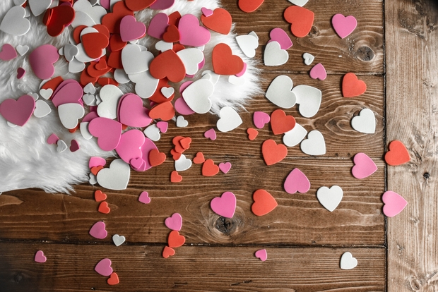 small hearts flatlay on animal skin rug