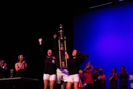 Amber holding up a trophy