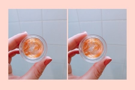 hand holding pot of makeup glitter