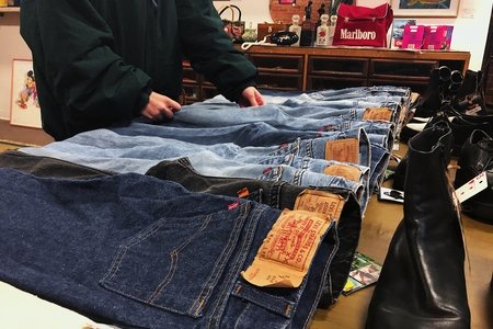 hand touching jeans