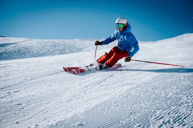 Man ice skiing on hill