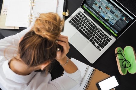 Woman sitting in front of computer
