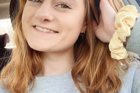 Selfie of a young lady in her car