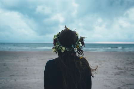 woman standing near seashore during daytime