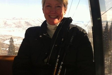 woman smiling on a ski lift