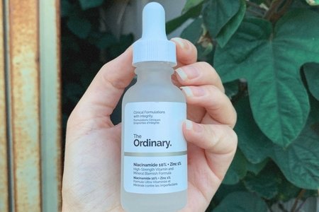 skincare product in front of leaves outside