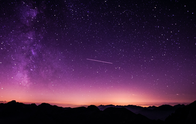silhouette photo of mountain during night time, purple sky with shooting star