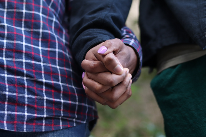 men holding handsjpg by Photographer Wandile Dlamini